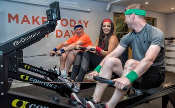 Three people on rowing machines